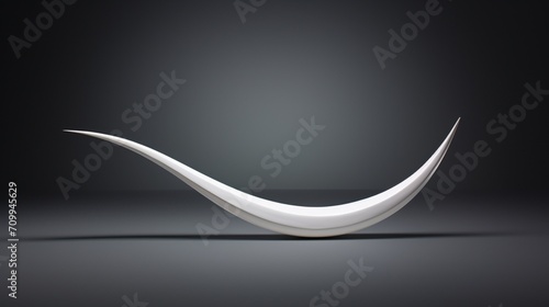 Against a clean white backdrop, an isolated sickle takes the spotlight, its sharp curves and craftsmanship detailed in high definition. photo
