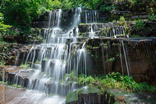 Long exposure photo of majestic waterfall Tupavica in lush green forest scenery Stara Planina mountain  Serbia