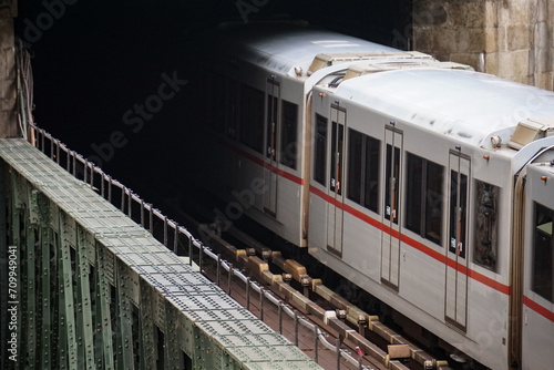 Photography City train crossing steel bridge into dark tunnel ominous cinematic