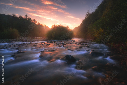 sunrise over fast mountain river