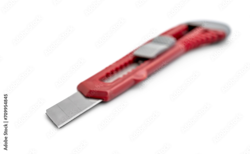 Red stationery knife on a white background. Red stationery knife on a white background.