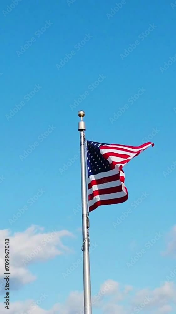 View of American flag and blue sky View of American flag and blue sky