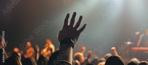 Raised hand at Christian music concert. photo
