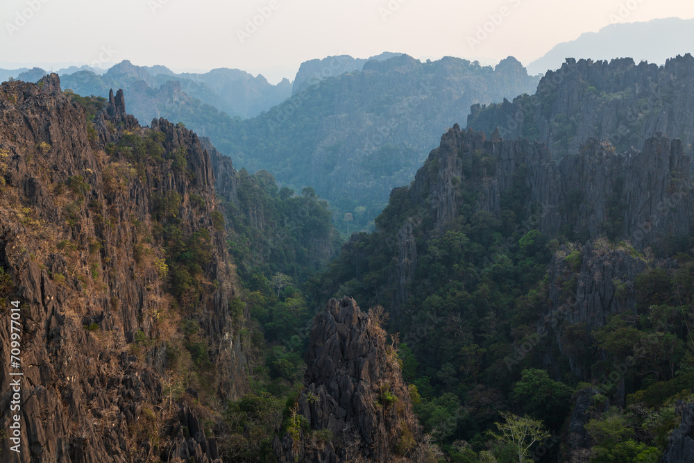 Silhouettes of limestone rocky hills at sunset. Laos Silhouettes of limestone rocky hills at sunset. Laos
