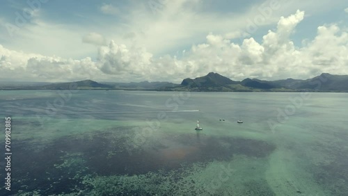 Drone footage over small islands in the Indian Ocean with old ruin. Mauritius photo