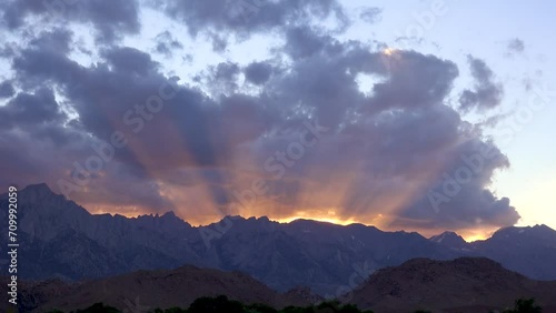 CALIFORNIA - 2023 - Time-lapse of clouds passing over the sunset behind the Sierras in California. photo