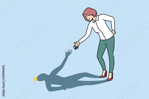 Business woman helps own shadow by demonstrating self-motivation and readiness to solve problems. Girl deals with troubles in business with resilience and restores self-confidence after failure.