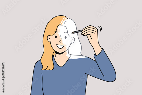 Woman draws own image with pencil, symbolizing self-development and desire to become better. Girl is interested in techniques for self-development and changing psychological state to achieve success