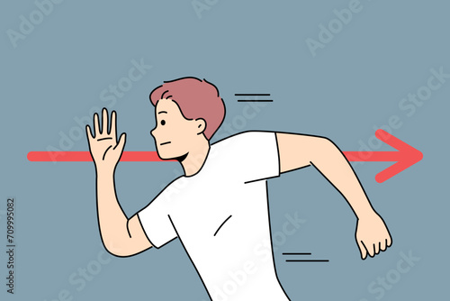 Brave man runs in opposite direction near red arrow, demonstrating rebellion and non-conformity. Guy with unconventional thinking channels own energy and strength and shows rebellion