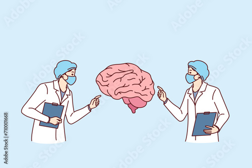 Neurosurgeons doctors study patient brain and conduct analysis in search of way to treat alzheimer disease. Neurosurgeons in white coats participate in consultation and diagnose sick
