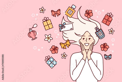 Woman among perfumes bottles and flower buds rejoices at opportunity to use aromatherapy from natural substances. Happy girl lying near perfumes or gift boxes in honor of march 8th holiday