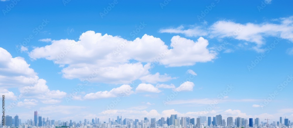 Tokyo's landscape in July, with a clear blue sky and clouds. - obrazy, fototapety, plakaty 