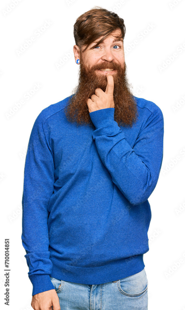 Young irish redhead man wearing casual clothes looking confident at the camera with smile with crossed arms and hand raised on chin. thinking positive. Young irish redhead man wearing casual clothes looking confident at the camera with smile with crossed arms and hand raised on chin. thinking positive.