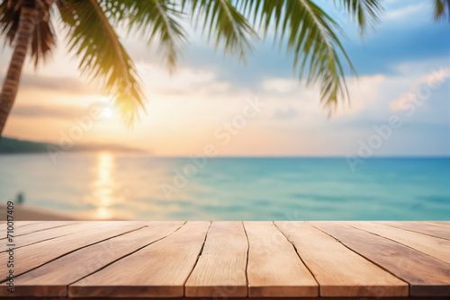 Top of wood table with seascape and palm tree  blur bokeh light of calm sea and sky at tropical beach background