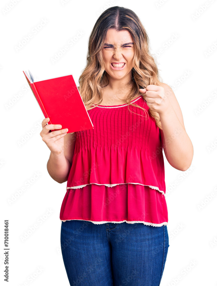 Young caucasian woman holding book annoyed and frustrated shouting with anger, yelling crazy with anger and hand raised Young caucasian woman holding book annoyed and frustrated shouting with anger, yelling crazy with anger and hand raised