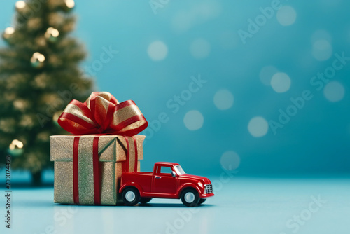 Desirable present on Christmas concept Close up photo of small toy luxurious stylish car wrapped with red ribbon standing near spruce green tree isolated over light color blue background Generative AI