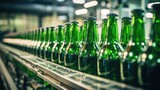 Green glass bottles without labels on the conveyor. Beer factory
