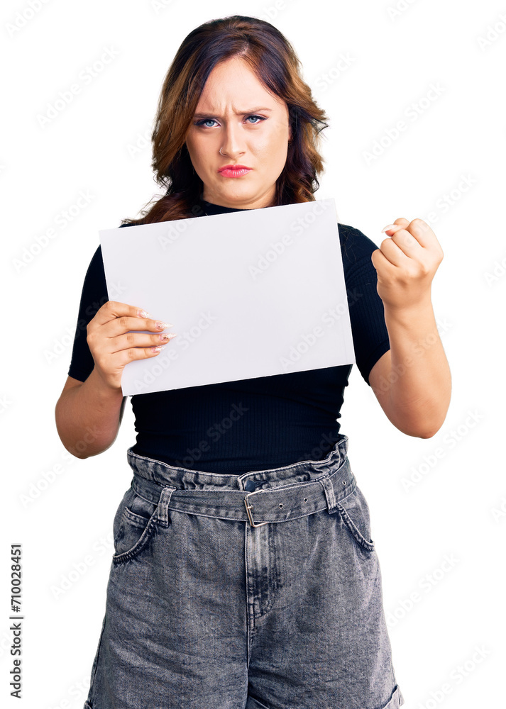 Young beautiful caucasian woman holding blank empty paper annoyed and frustrated shouting with anger, yelling crazy with anger and hand raised Young beautiful caucasian woman holding blank empty paper annoyed and frustrated shouting with anger, yelling crazy with anger and hand raised