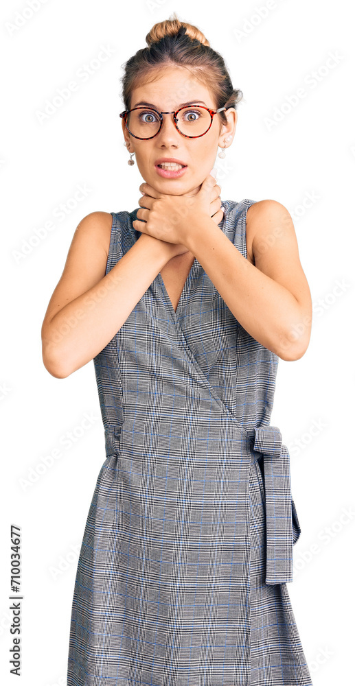 Beautiful caucasian woman with blonde hair wearing business clothes and glasses shouting and suffocate because painful strangle. health problem. asphyxiate and suicide concept. Beautiful caucasian woman with blonde hair wearing business clothes and glasses shouting and suffocate because painful strangle. health problem. asphyxiate and suicide concept.
