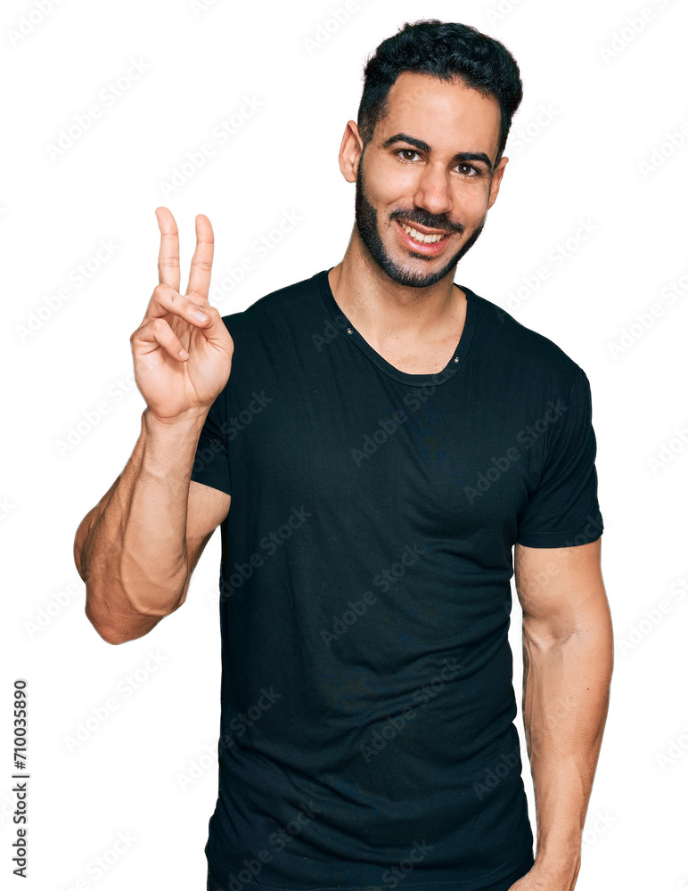 Hispanic man with beard wearing casual black t shirt showing and pointing up with fingers number two while smiling confident and happy. Hispanic man with beard wearing casual black t shirt showing and pointing up with fingers number two while smiling confident and happy.