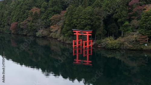 Aerial view of Hakone, Japan, showing famous red torii gate on the shore of Lake Ashi in autumn season.  photo