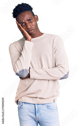 Young african american man wearing casual clothes thinking looking tired and bored with depression problems with crossed arms.