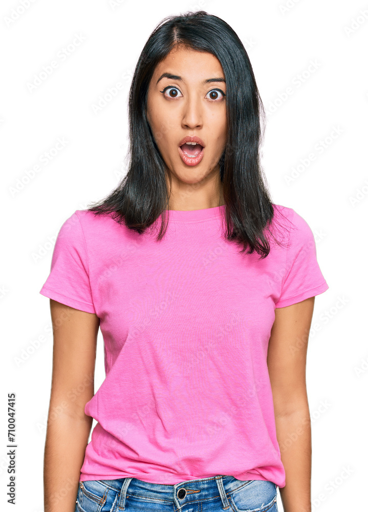 Beautiful asian young woman wearing casual pink t shirt afraid and shocked with surprise expression, fear and excited face. Beautiful asian young woman wearing casual pink t shirt afraid and shocked with surprise expression, fear and excited face.