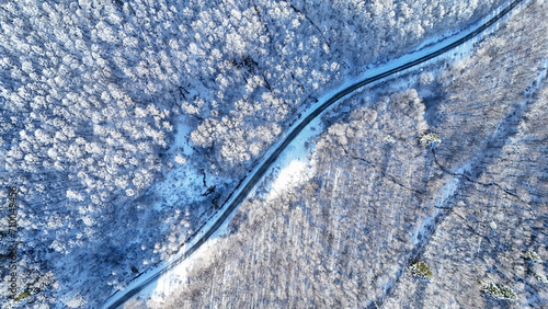 Aerial view of a snowy mountain road © Ljupco Smokovski