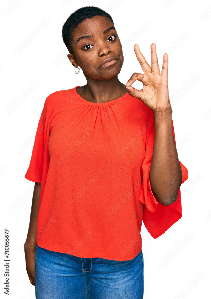 Young african american woman wearing casual clothes smiling positive doing ok sign with hand and fingers. successful expression. Young african american woman wearing casual clothes smiling positive doing ok sign with hand and fingers. successful expression.
