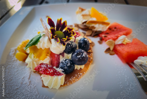 Obraz na płótnie Dessert with whipped cream and fruits such as blueberry, strawberry and watermelon etc. w salonie