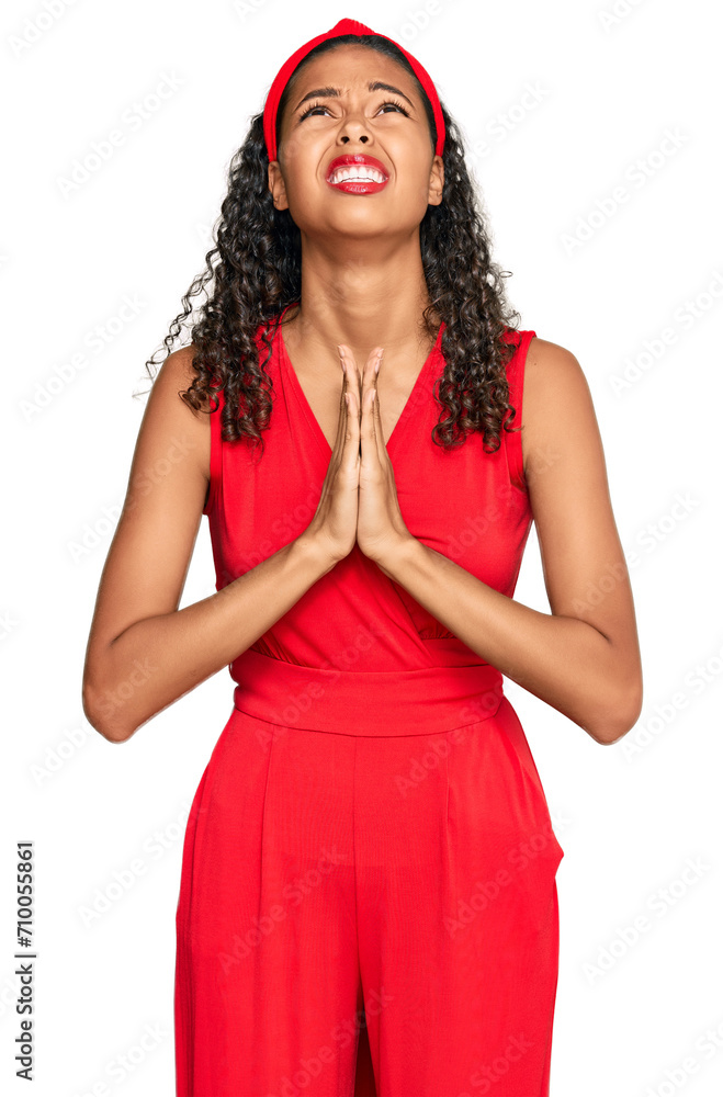 Young african american girl wearing elegant and sexy look begging and praying with hands together with hope expression on face very emotional and worried. begging. Young african american girl wearing elegant and sexy look begging and praying with hands together with hope expression on face very emotional and worried. begging.