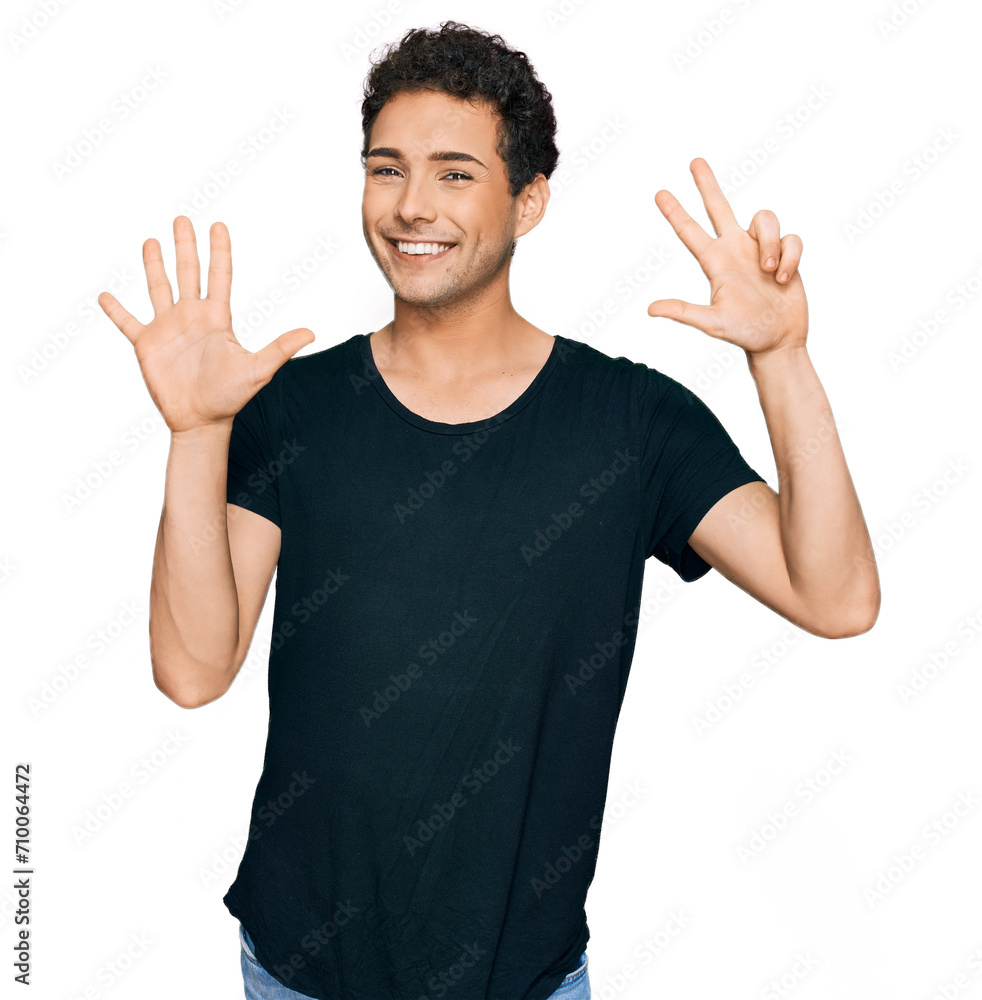 Young handsome man wearing casual black t shirt showing and pointing up with fingers number eight while smiling confident and happy. Young handsome man wearing casual black t shirt showing and pointing up with fingers number eight while smiling confident and happy.