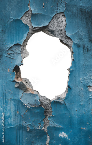 torn hole in a old cracked sky blue concrete wall. Peeling old sky blue paint. Cracked and peeling, Grunge wall texture. Worn aged post apocalyptic texture background with a hole in the wall.