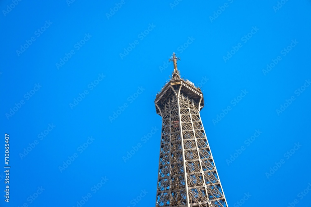 Top and third level of the Eiffel Tower in Paris, France on a summer day