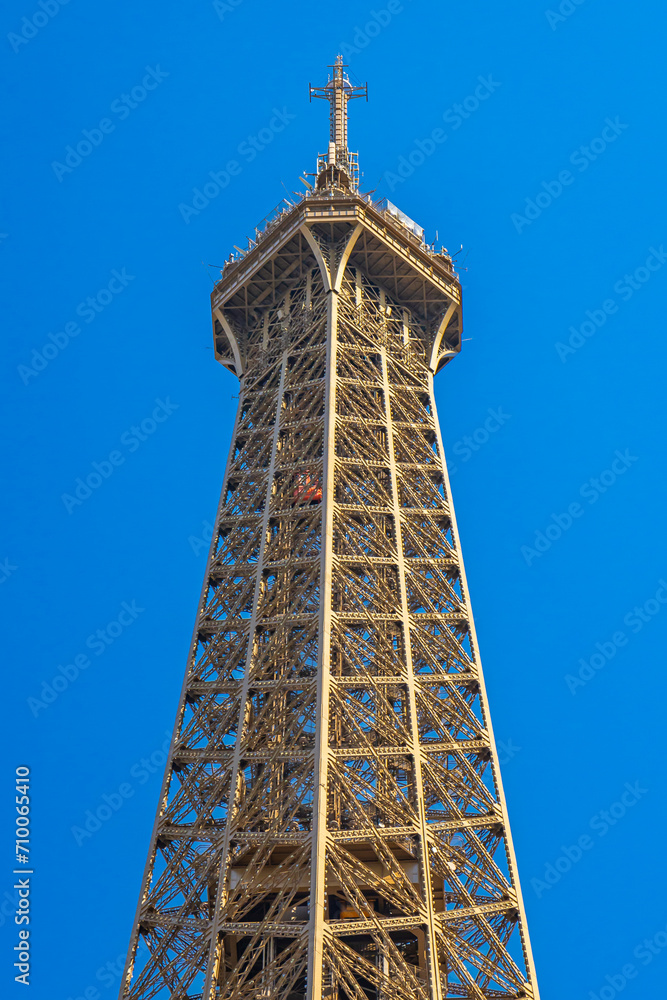 Top and third level of the Eiffel Tower in Paris, France on a summer day Top and third level of the Eiffel Tower in Paris, France on a summer day
