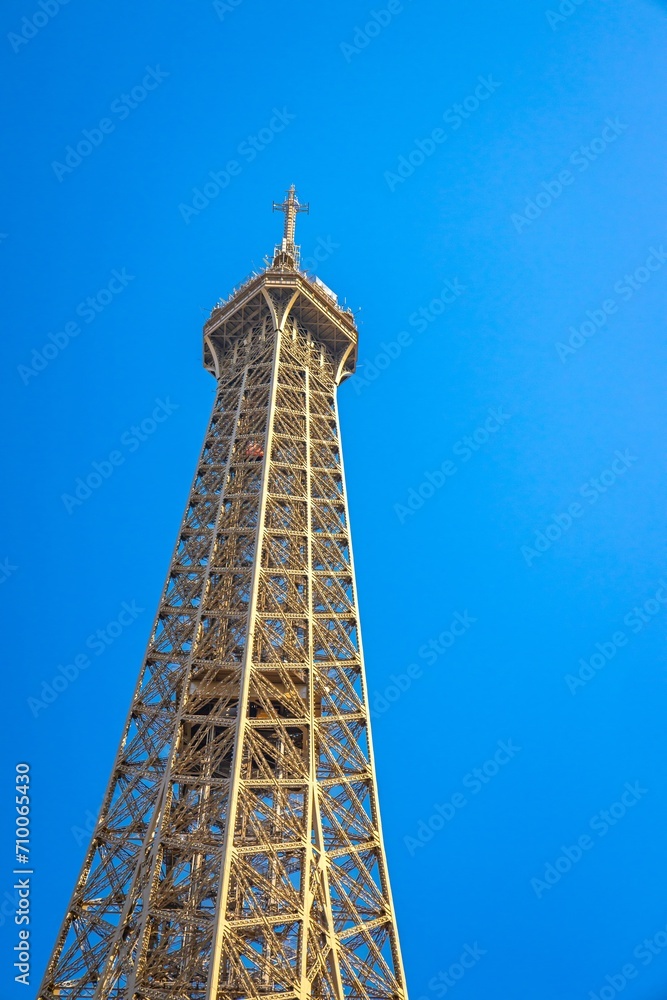 Top and third level of the Eiffel Tower in Paris, France on a summer day