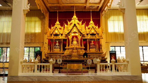 Golden buddha statue in Thakhanun temple of  Kanchanaburi Province,Thailand.Thailand travel concept. photo