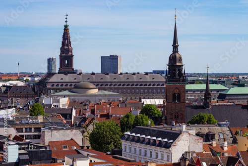 Christiansborg Slot Palace, Church of Holy Ghost and historical houses in center of Copenhagen, Denmark. Top view from the observation deck on the top of the Round Tower (Danish: Rundetaarn) photo