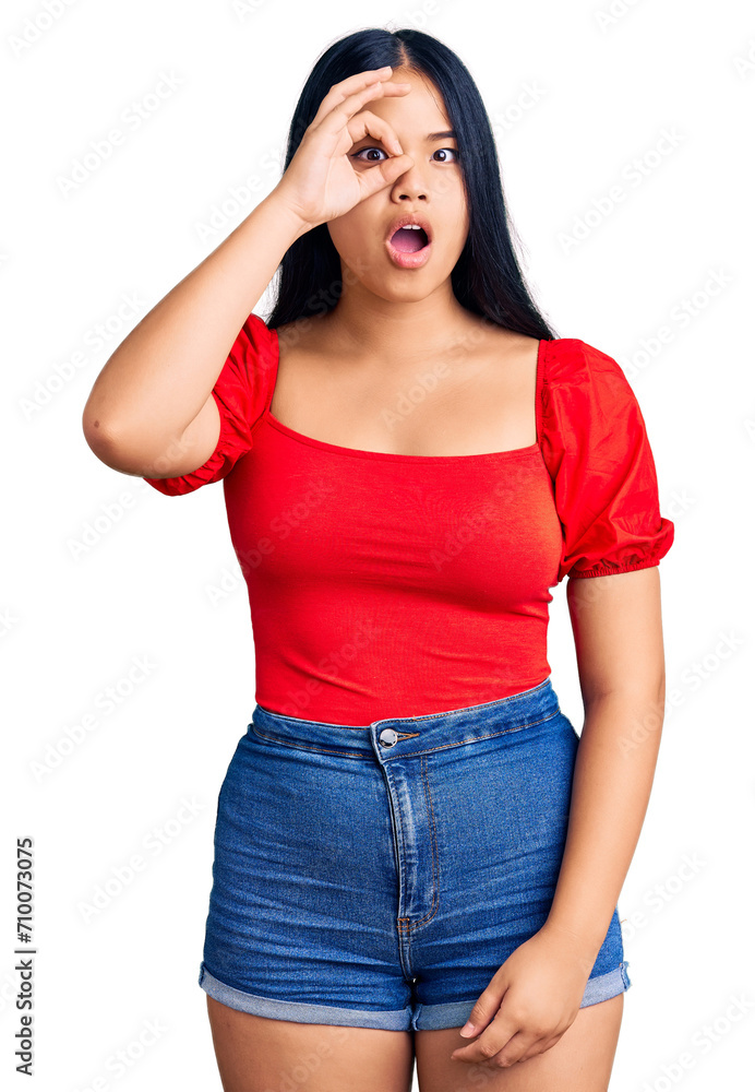Young beautiful asian girl wearing casual clothes doing ok gesture shocked with surprised face, eye looking through fingers. unbelieving expression. Young beautiful asian girl wearing casual clothes doing ok gesture shocked with surprised face, eye looking through fingers. unbelieving expression.
