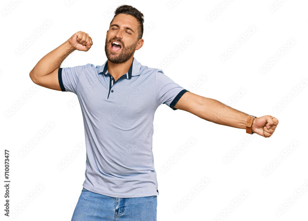 Handsome man with beard wearing casual clothes dancing happy and cheerful, smiling moving casual and confident listening to music Handsome man with beard wearing casual clothes dancing happy and cheerful, smiling moving casual and confident listening to music