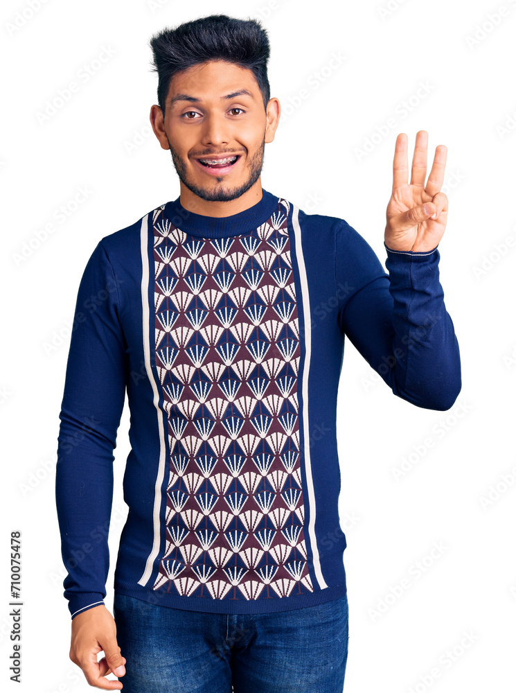 Handsome latin american young man wearing casual winter sweater showing and pointing up with fingers number three while smiling confident and happy. Handsome latin american young man wearing casual winter sweater showing and pointing up with fingers number three while smiling confident and happy.