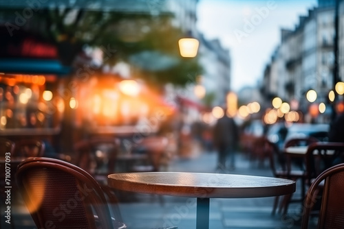 Unfocused cafes, buildings and people. Natural bokeh of city centre view, blurred out of focus background.