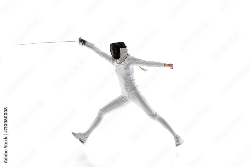 Sport equipment. The fencing foil, mask, and suit represent the essential equipment for the sport. Female fencing athlete training isolated over white background. Concept of sport, championship Sport equipment. The fencing foil, mask, and suit represent the essential equipment for the sport. Female fencing athlete training isolated over white background. Concept of sport, championship