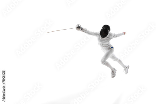 Action and motion. The dynamic motion of an athlete captured in a high-speed photograph. Female fencer training. Banner for ad. Concept of professional sport, competition, championship, hobby
