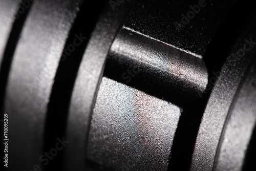 Texture of a black metal part close-up. Black powder metal, macro photography, fine detail