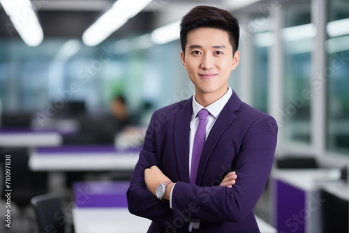 happy businessman ceo, asian man, standing in office arms crossed, in purple jacket and white shirt, elegant
