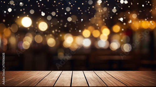 Wooden table in front of abstract blurred restaurant lights background