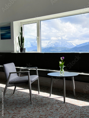 Scandinavian interior with a view of the mountains photo