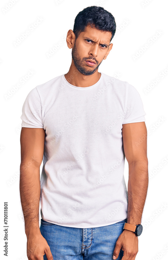 Young latin man wearing casual clothes skeptic and nervous, frowning upset because of problem. negative person. Young latin man wearing casual clothes skeptic and nervous, frowning upset because of problem. negative person.