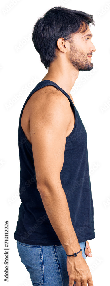Handsome hispanic man wearing casual clothes looking to side, relax profile pose with natural face with confident smile. Handsome hispanic man wearing casual clothes looking to side, relax profile pose with natural face with confident smile.